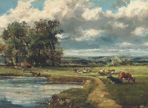 Cattle grazing by a river